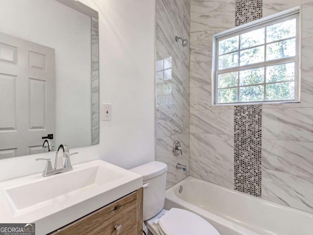 bathroom featuring shower / bathing tub combination, vanity, and toilet