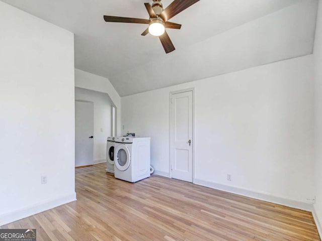 interior space featuring laundry area, washing machine and dryer, light wood-style flooring, and a ceiling fan