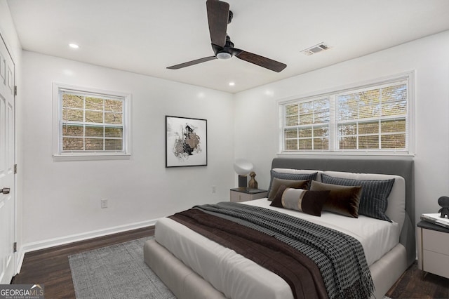 bedroom with recessed lighting, visible vents, multiple windows, and wood finished floors