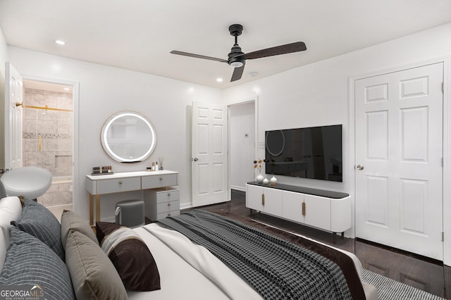 bedroom with recessed lighting, baseboards, ensuite bath, and dark wood finished floors