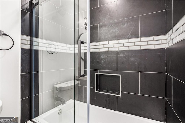 full bathroom with shower / bath combination with glass door