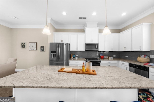 kitchen with white cabinets, visible vents, backsplash, and stainless steel appliances