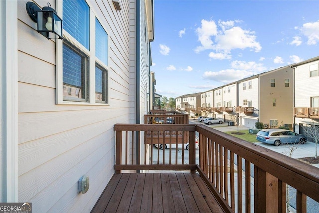 wooden deck with a residential view