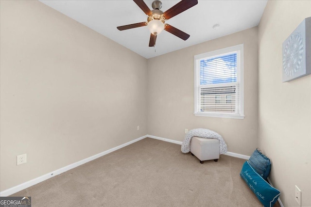 unfurnished room with carpet, baseboards, and ceiling fan