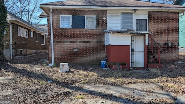 exterior space with brick siding