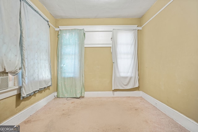 spare room with carpet flooring and baseboards