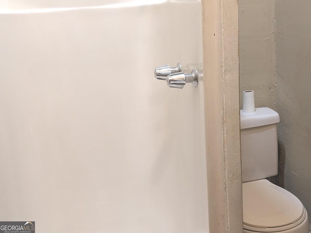 bathroom featuring toilet