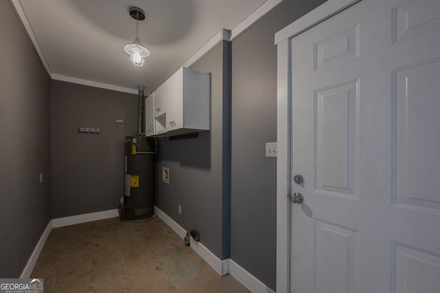 clothes washing area with hookup for a washing machine, laundry area, water heater, and baseboards