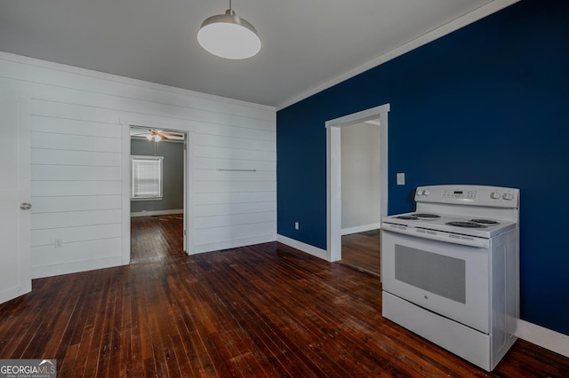 kitchen featuring white electric stove, baseboards, and hardwood / wood-style flooring