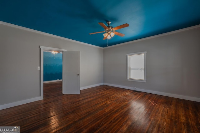 empty room with hardwood / wood-style floors, ceiling fan, ornamental molding, and baseboards