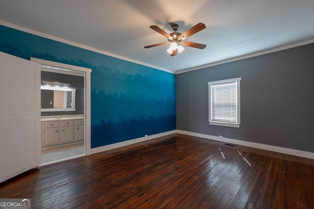 empty room featuring ceiling fan, wood-type flooring, and baseboards