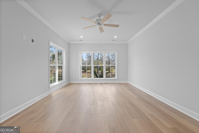 empty room featuring ornamental molding, recessed lighting, light wood-style flooring, and baseboards