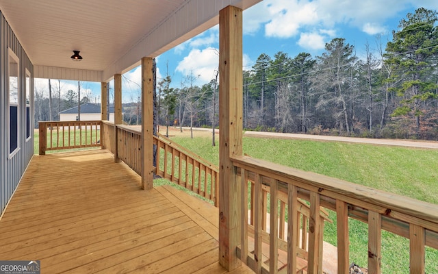 deck featuring a lawn