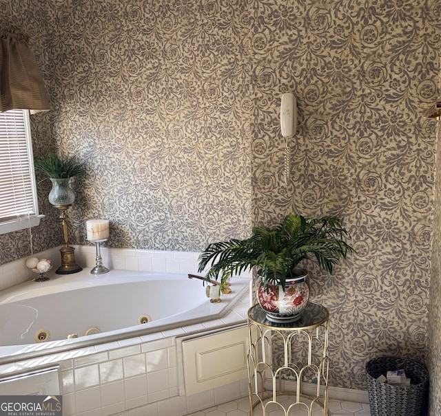 bathroom featuring a whirlpool tub and wallpapered walls