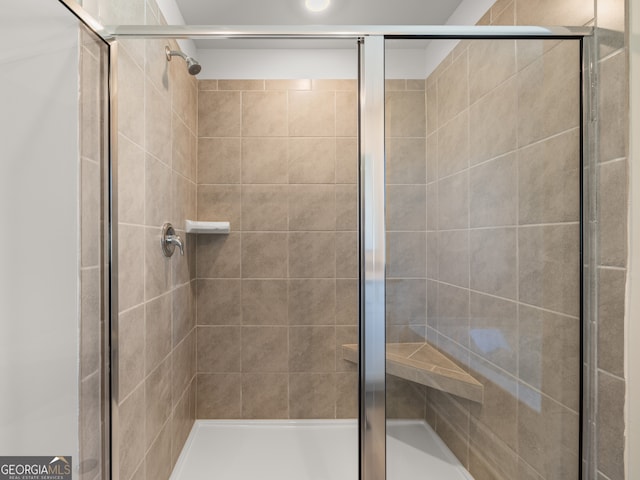 bathroom featuring a shower stall