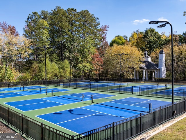 view of sport court with fence