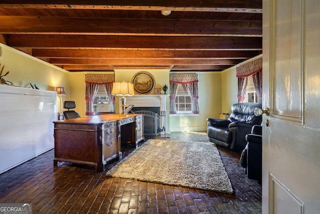 living room with brick floor, a fireplace, and beam ceiling