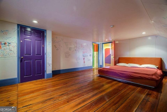 bedroom with recessed lighting, lofted ceiling, baseboards, and hardwood / wood-style flooring