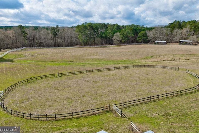 bird's eye view with a rural view and a wooded view