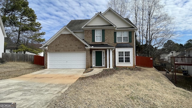 traditional-style house with brick siding, driveway, and fence