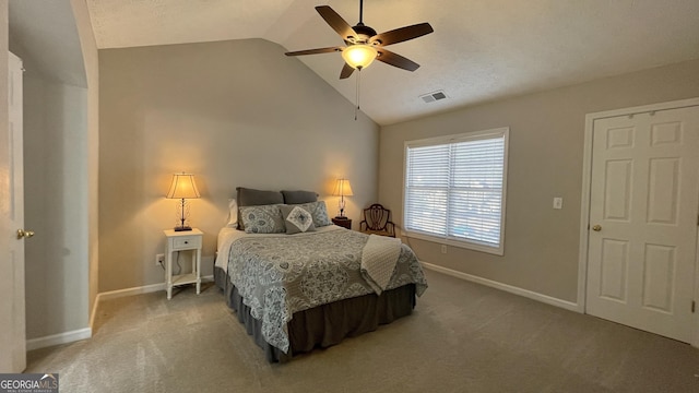 bedroom featuring lofted ceiling, carpet floors, visible vents, and baseboards