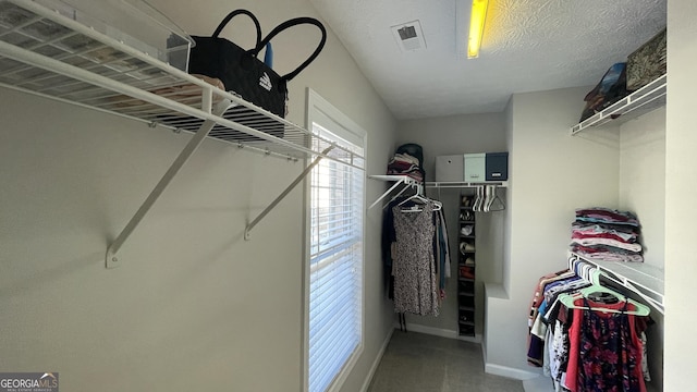 walk in closet featuring visible vents