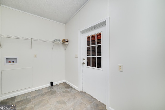 laundry room featuring laundry area, hookup for a washing machine, and a textured ceiling