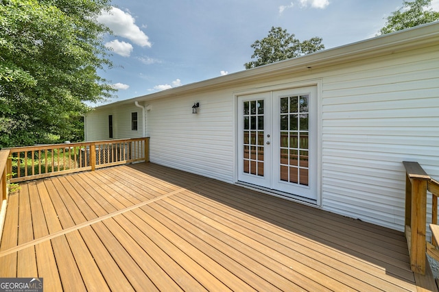 wooden deck featuring french doors