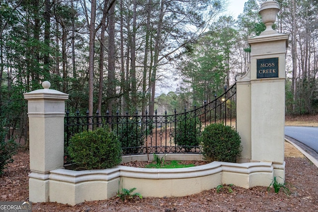 view of gate with fence