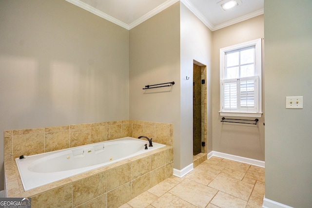 bathroom with baseboards, a shower stall, a tub with jets, and crown molding