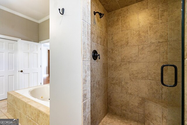 bathroom featuring a stall shower, crown molding, and a jetted tub