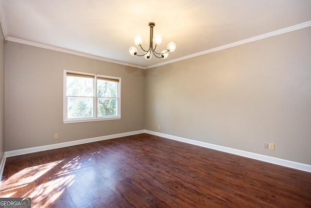 unfurnished room with crown molding, baseboards, dark wood-type flooring, and a notable chandelier