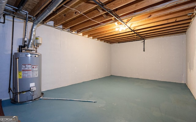 unfinished below grade area featuring gas water heater