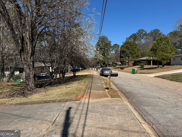 view of road featuring curbs and sidewalks