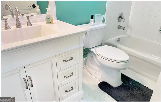 bathroom with washtub / shower combination, tile patterned flooring, vanity, and toilet