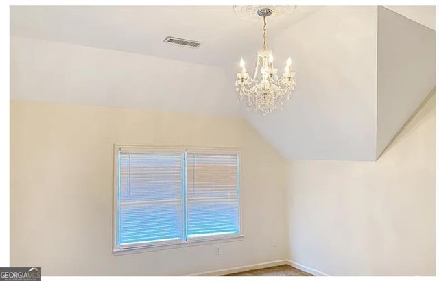 bonus room with carpet floors, baseboards, visible vents, and vaulted ceiling