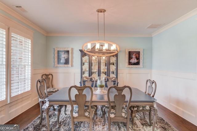 dining room featuring a chandelier, dark wood-style floors, and visible vents