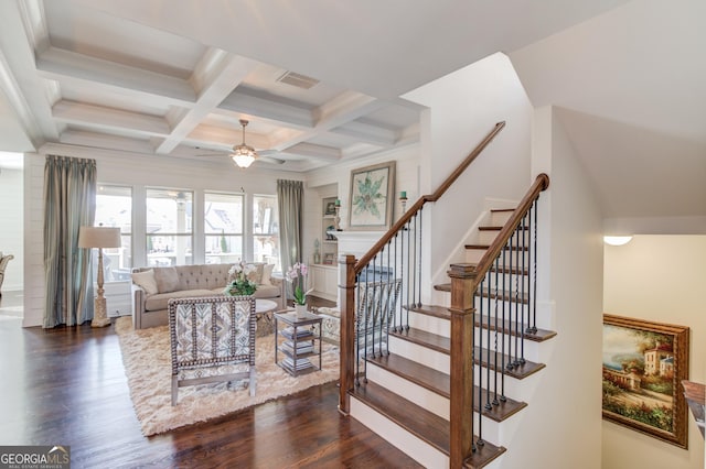 living room featuring visible vents, coffered ceiling, dark wood-style floors, stairway, and beamed ceiling