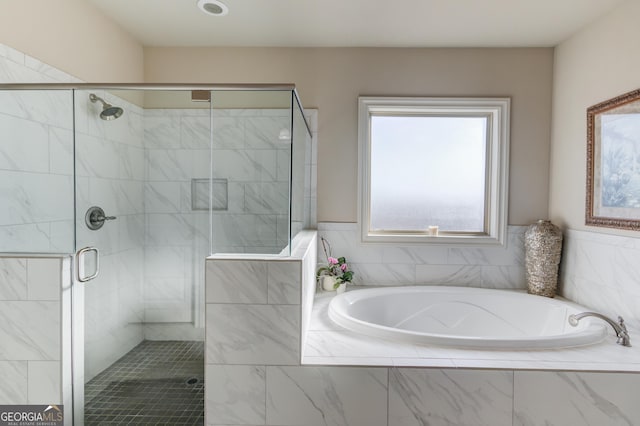 full bath with a garden tub and a shower stall