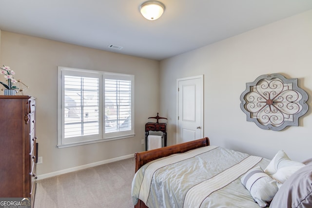 bedroom featuring carpet, visible vents, and baseboards