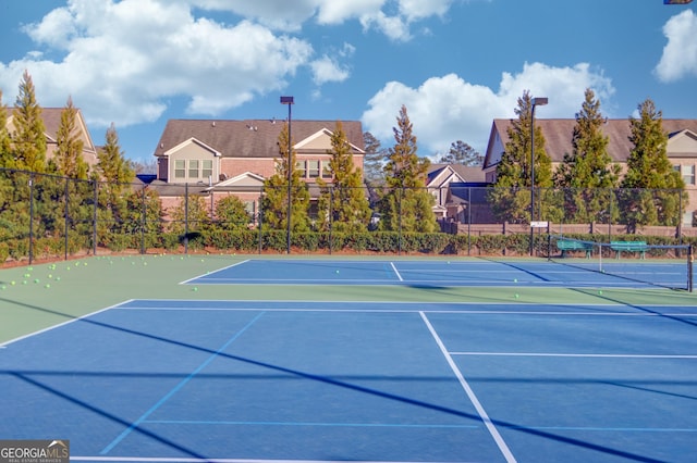 view of sport court with community basketball court and fence