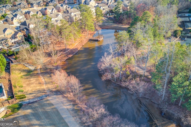 birds eye view of property with a water view and a residential view