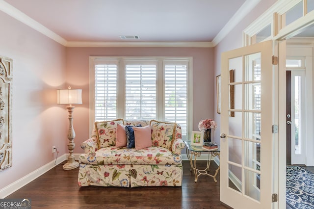 sitting room with ornamental molding, dark wood-style flooring, and visible vents