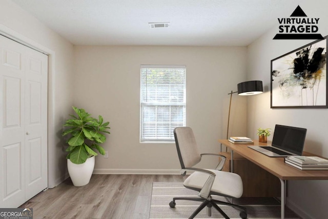 11139 Silver Aspen Ct, Hampton, GA 30228 - home office featuring light wood finished floors and baseboards