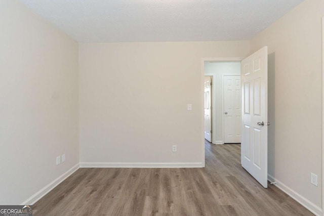 11139 Silver Aspen Ct, Hampton, GA 30228 - empty room featuring wood finished floors