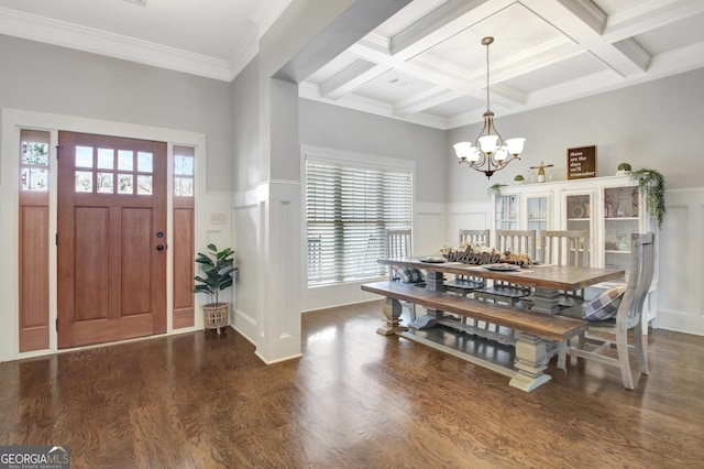 entrance foyer with a notable chandelier, coffered ceiling, wood finished floors, wainscoting, and beam ceiling