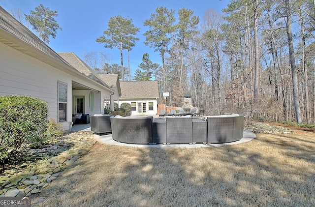 exterior space featuring a patio, a swimming pool, outdoor lounge area, and central air condition unit