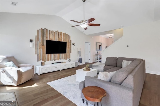 living area with a ceiling fan, lofted ceiling, visible vents, and wood finished floors