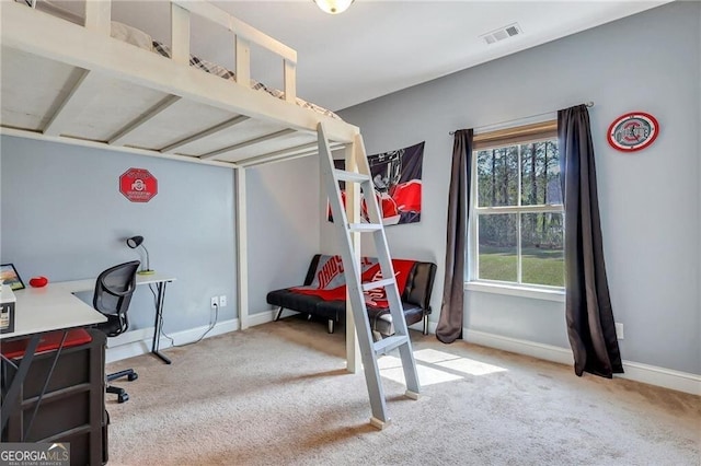 bedroom featuring baseboards, visible vents, and carpet flooring