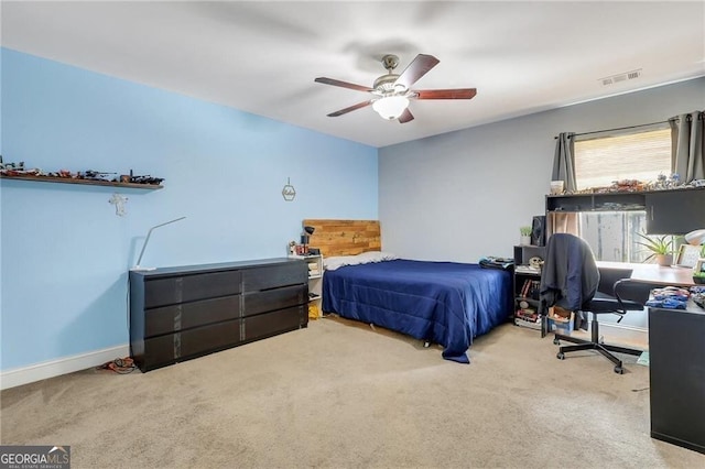 bedroom featuring a ceiling fan, carpet, visible vents, and baseboards